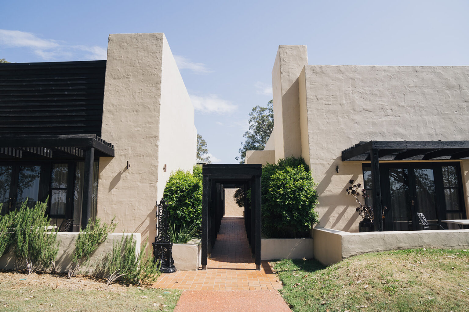 Sandstone walls and garden entrance at Tower Lodge