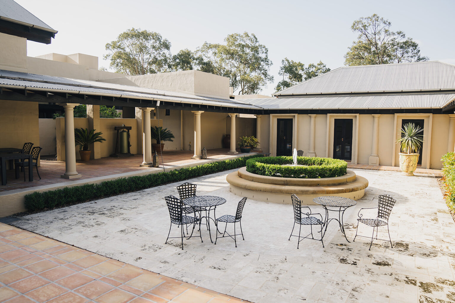 Tower Lodge courtyard with fountain and outdoor seating
