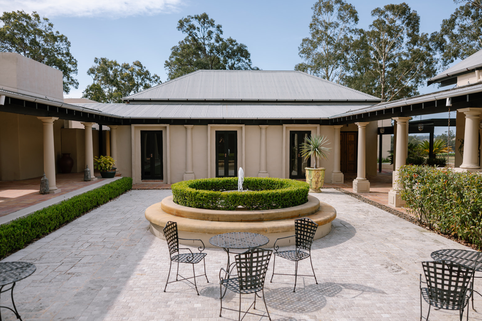 Central courtyard with round fountain at Tower Lodge