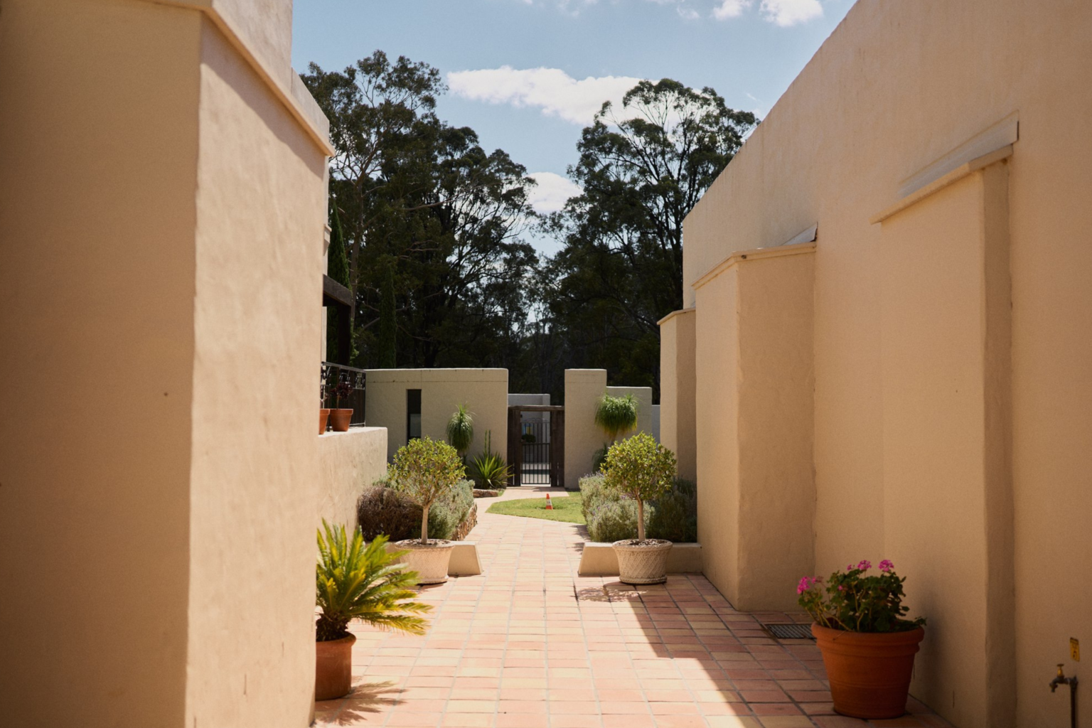 Terracotta courtyard walkway at Tower Lodge