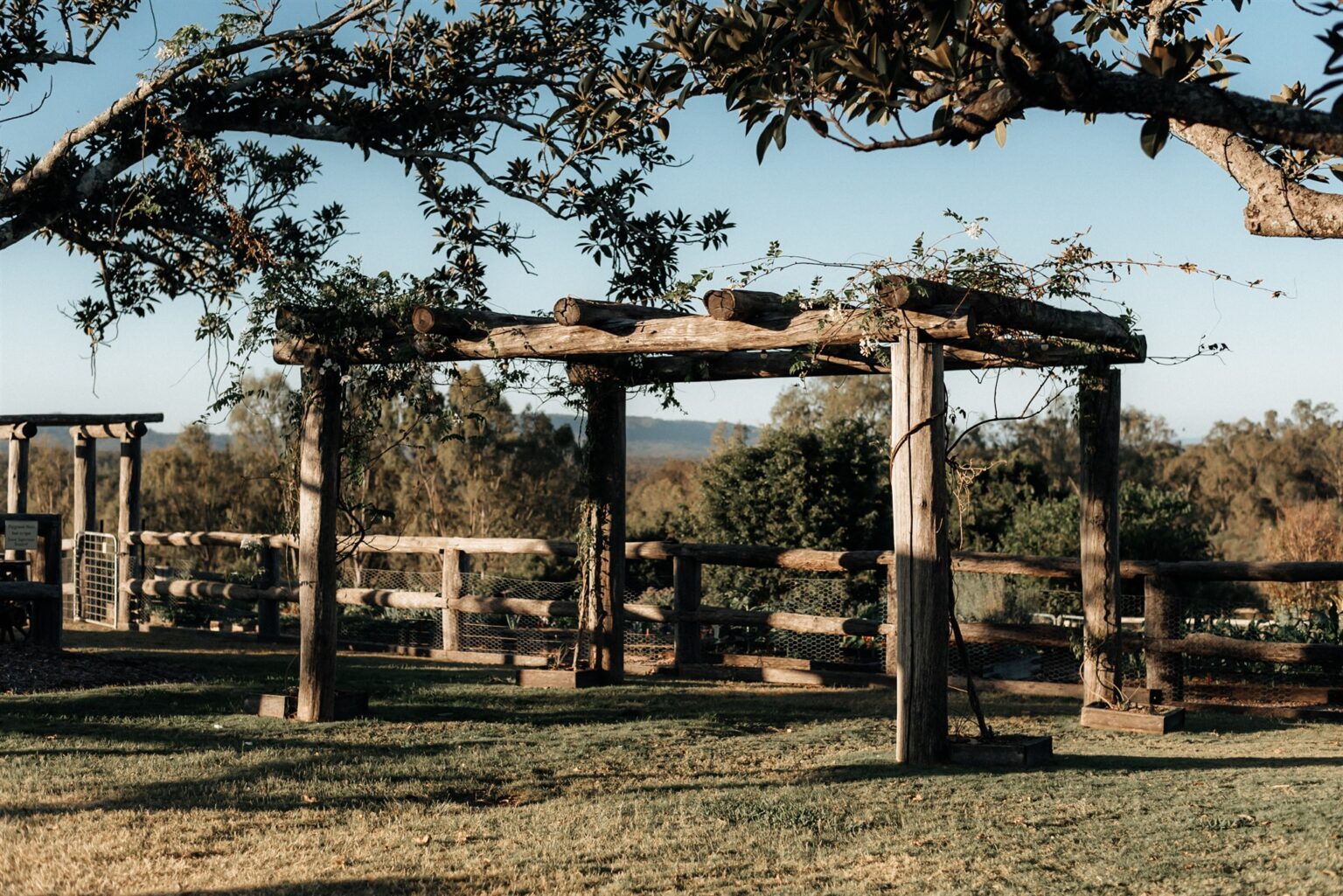 Rustic timber pergola ceremony site at Spicers Hidden Vale