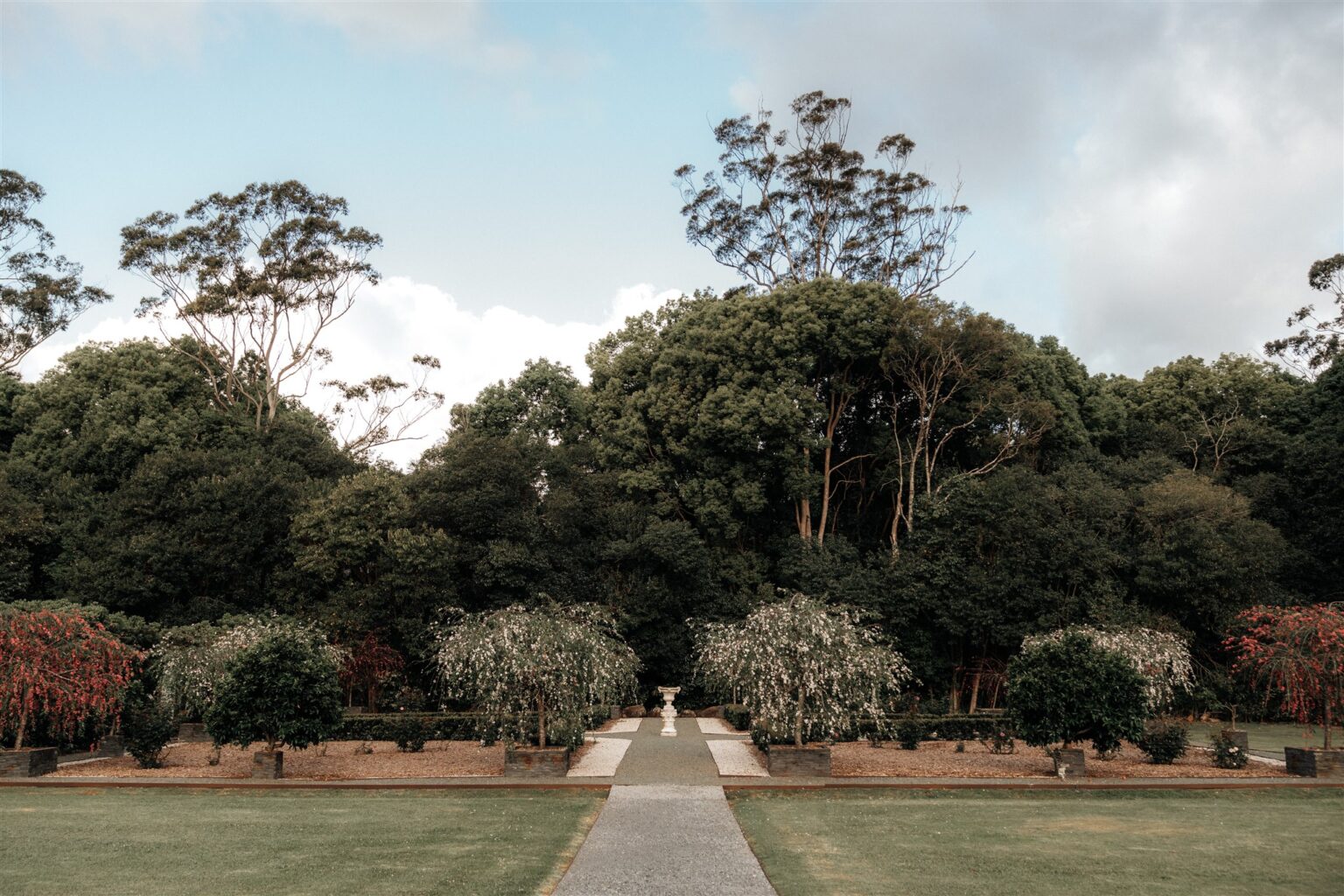 Formal hedge garden and gravel path at Wynmère Estate