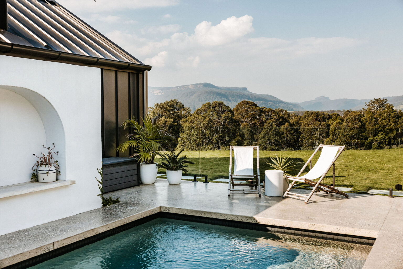 Plunge pool and deck chairs with valley views at La Belle Vallée