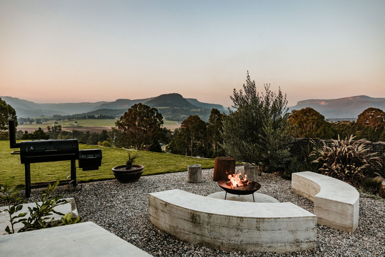 Fire pit seating at dusk overlooking Kangaroo Valley