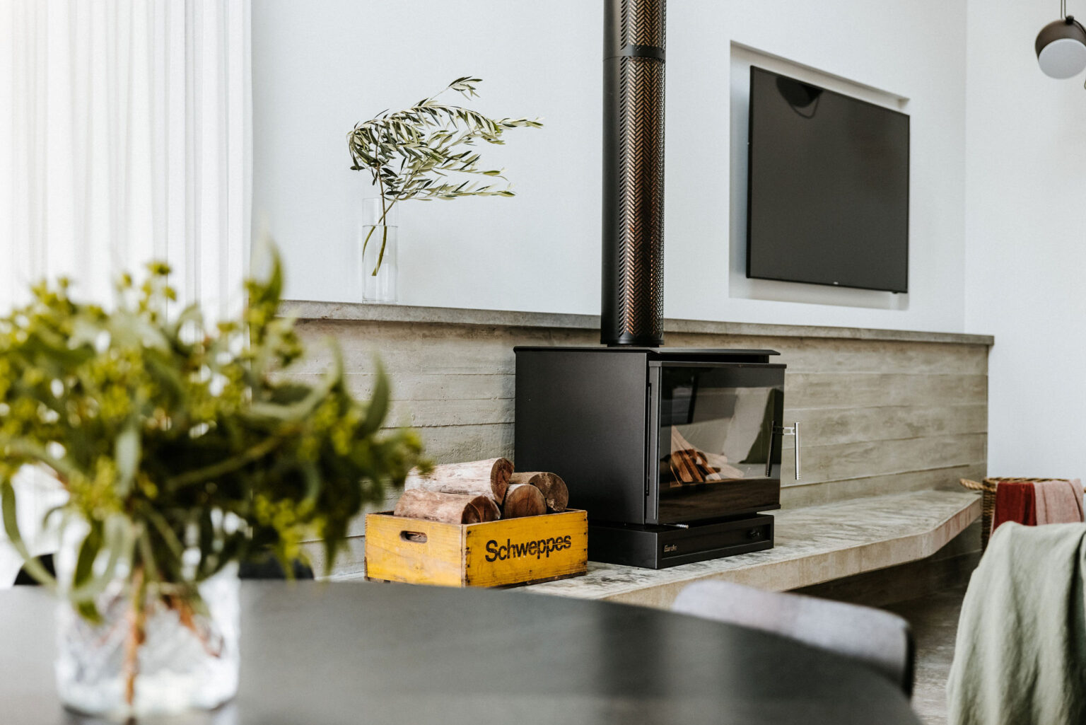 Wood fireplace and dining nook at La Belle Vallée