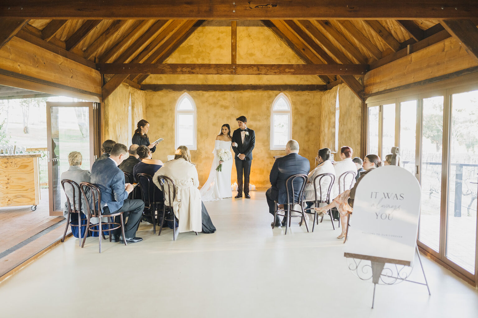 Guests seated for a ceremony in the chapel at Peppers Creek