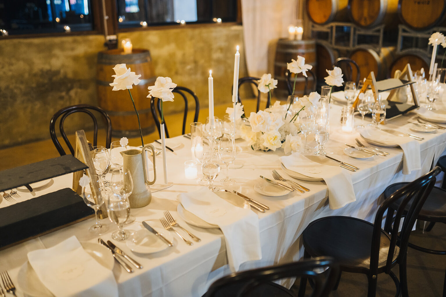 Long reception table set with candles in the Barrel Room