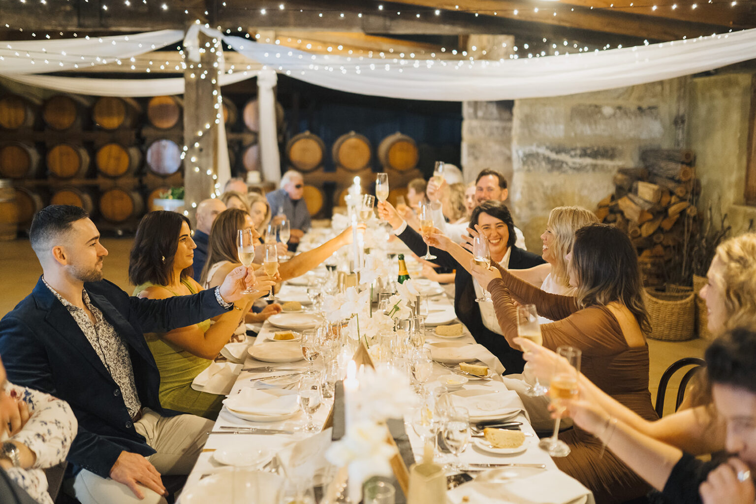 Guests raising a toast at the Barrel Room reception