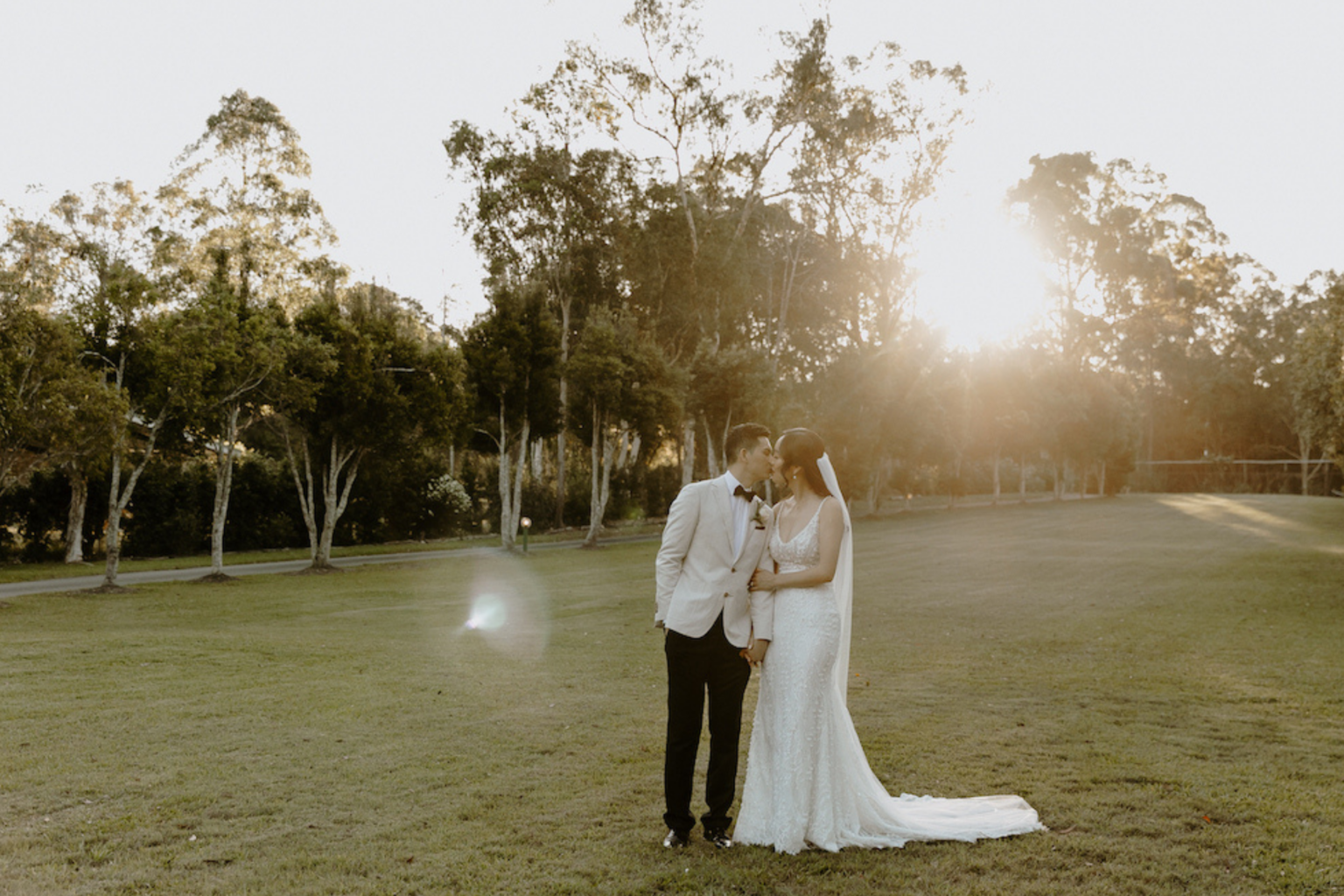 Couple on the open lawn at sunset at Coolibah Downs