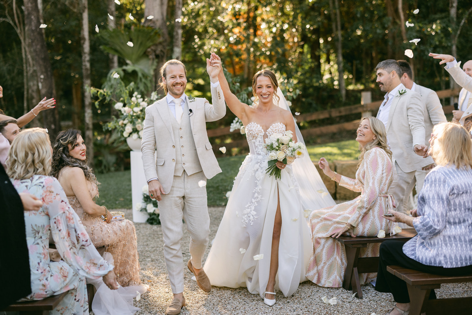 Newlyweds celebrating with guests after the ceremony