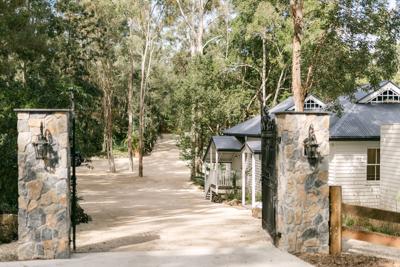 Stone gate pillars and driveway entrance at Kwila Lodge