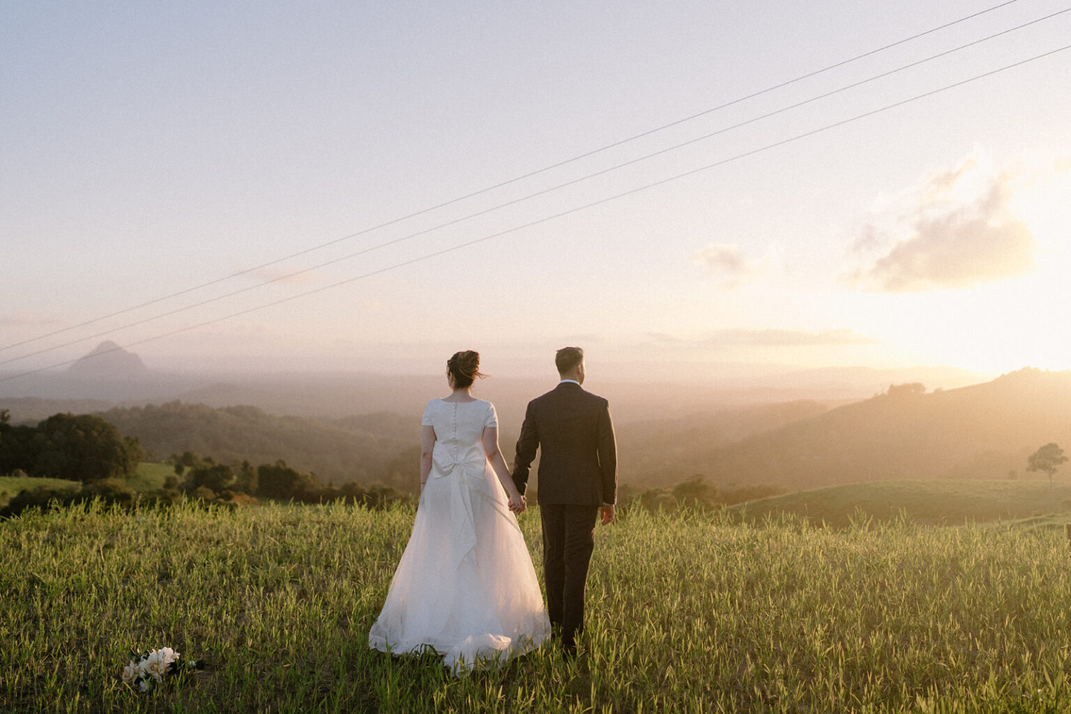 Couple overlooking the hinterland at sunset from Spicers Clovelly Estate