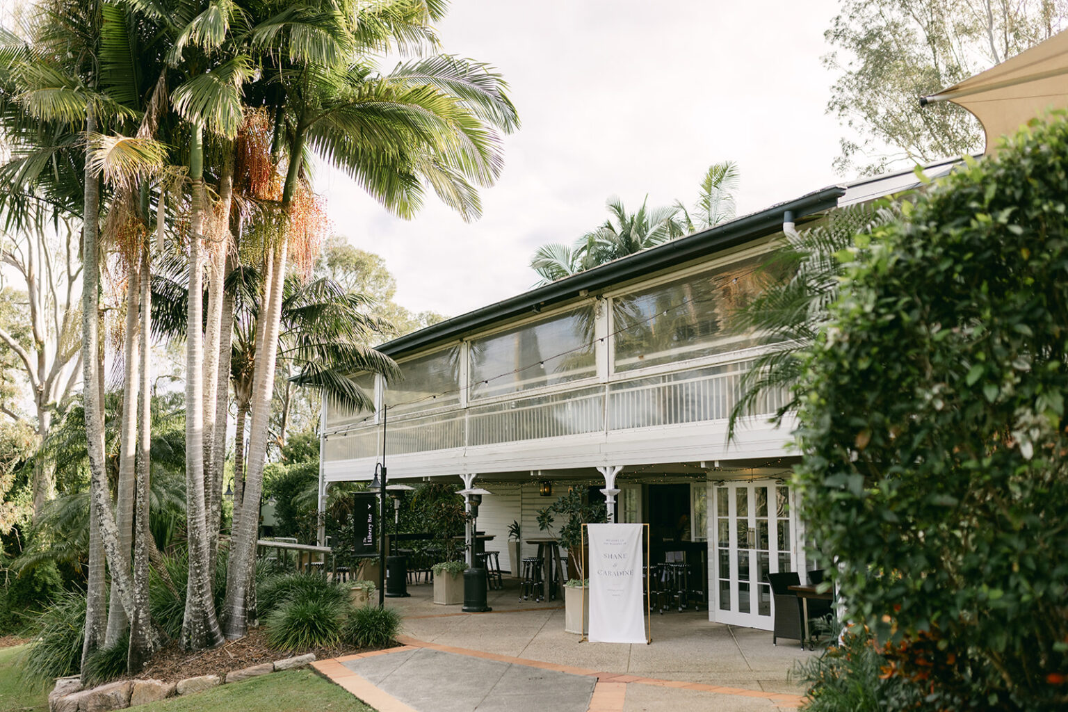 Hillstone St Lucia verandah framed by palms