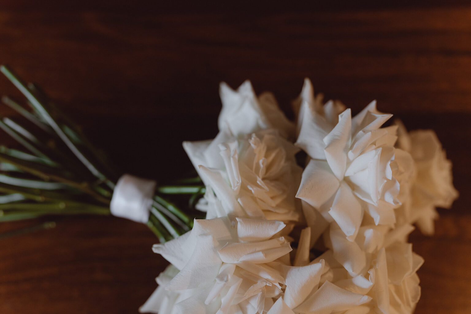 Bouquet of folded paper flowers on a timber table