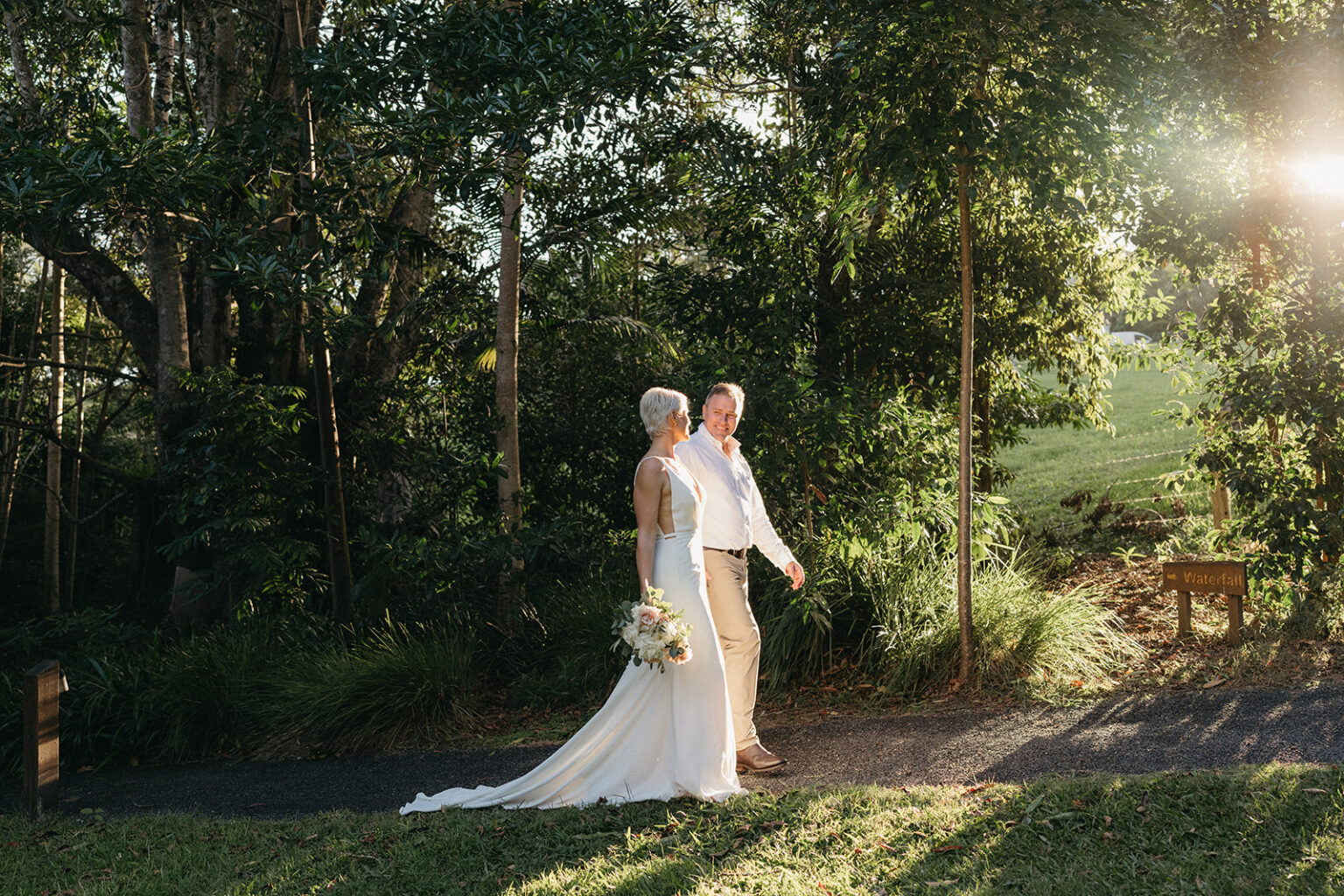 Couple walking through the gardens at Spicers Tamarind Retreat