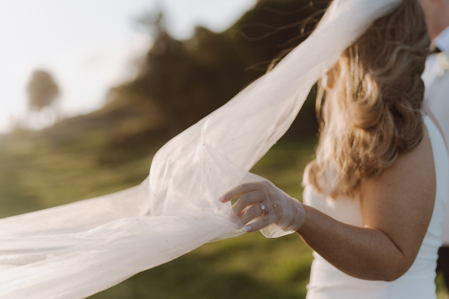Bride's veil catching the breeze