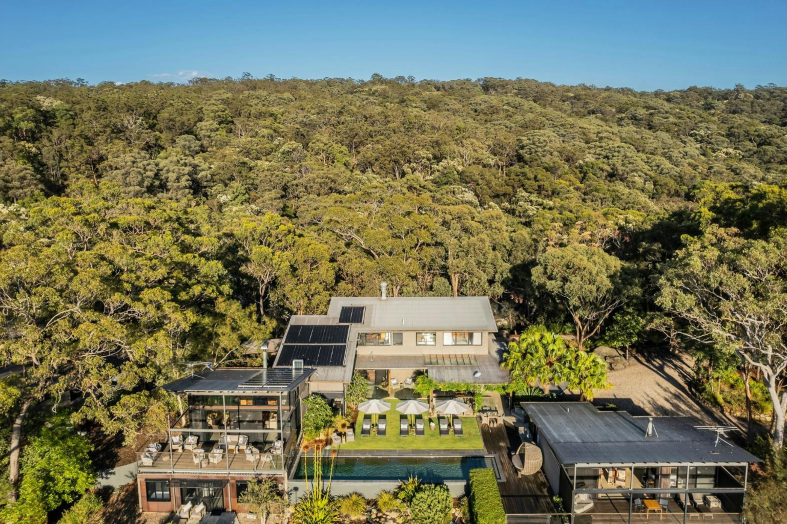 Aerial view of Spicers Sangoma Retreat surrounded by forest, Bowen Mountain