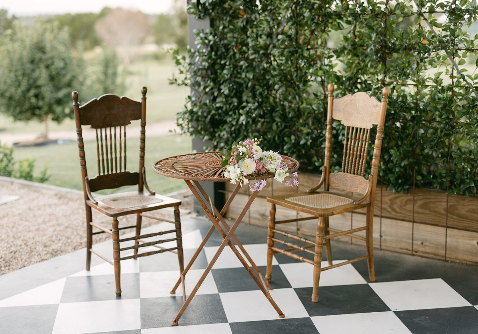 Vintage registry table and chairs on the checkerboard floor