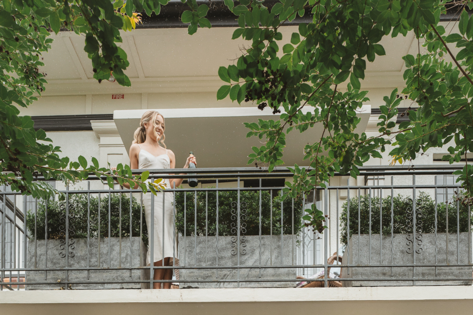 Bride on a leafy balcony at Spicers Balfour Hotel