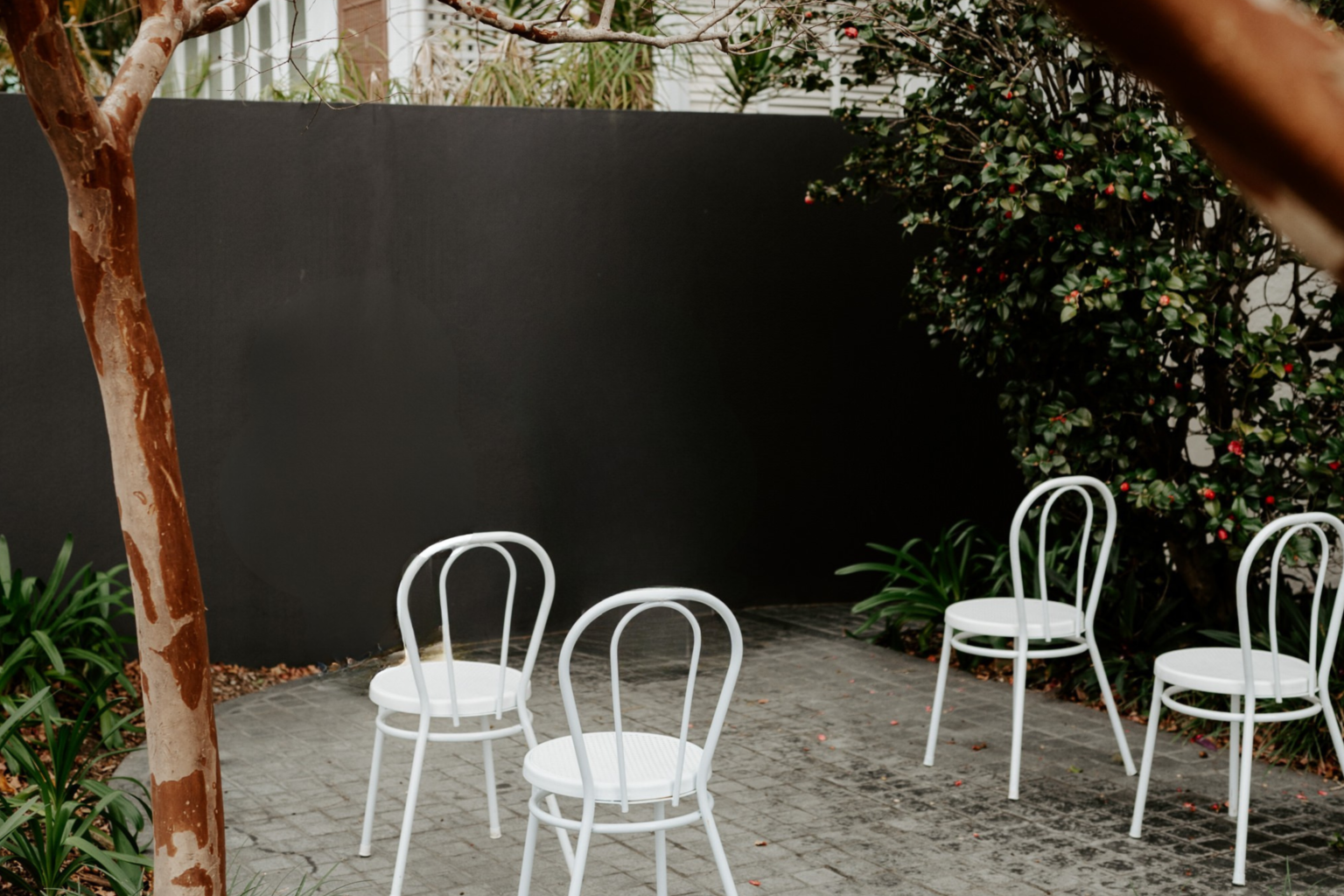 Simla Courtyard set with white ceremony chairs