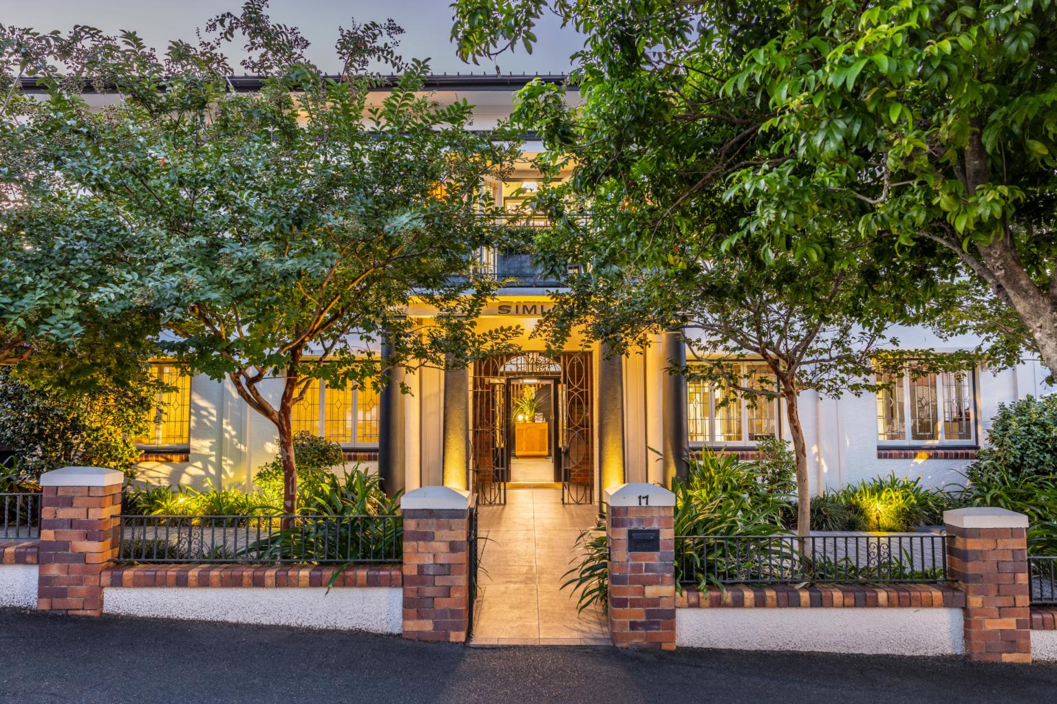 Spicers Balfour Hotel's heritage facade lit at dusk