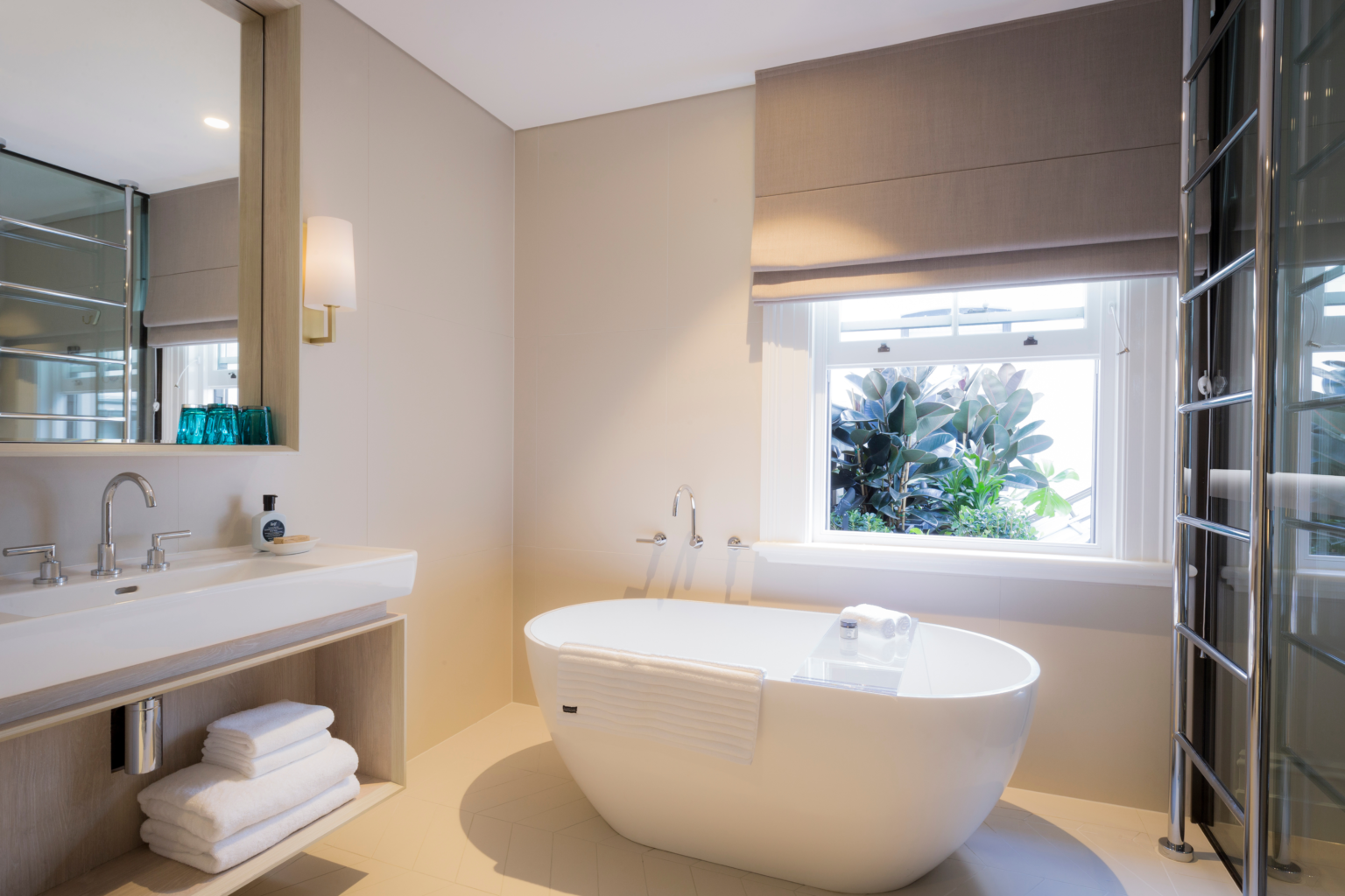 Luxe King Suite bathroom with freestanding bath