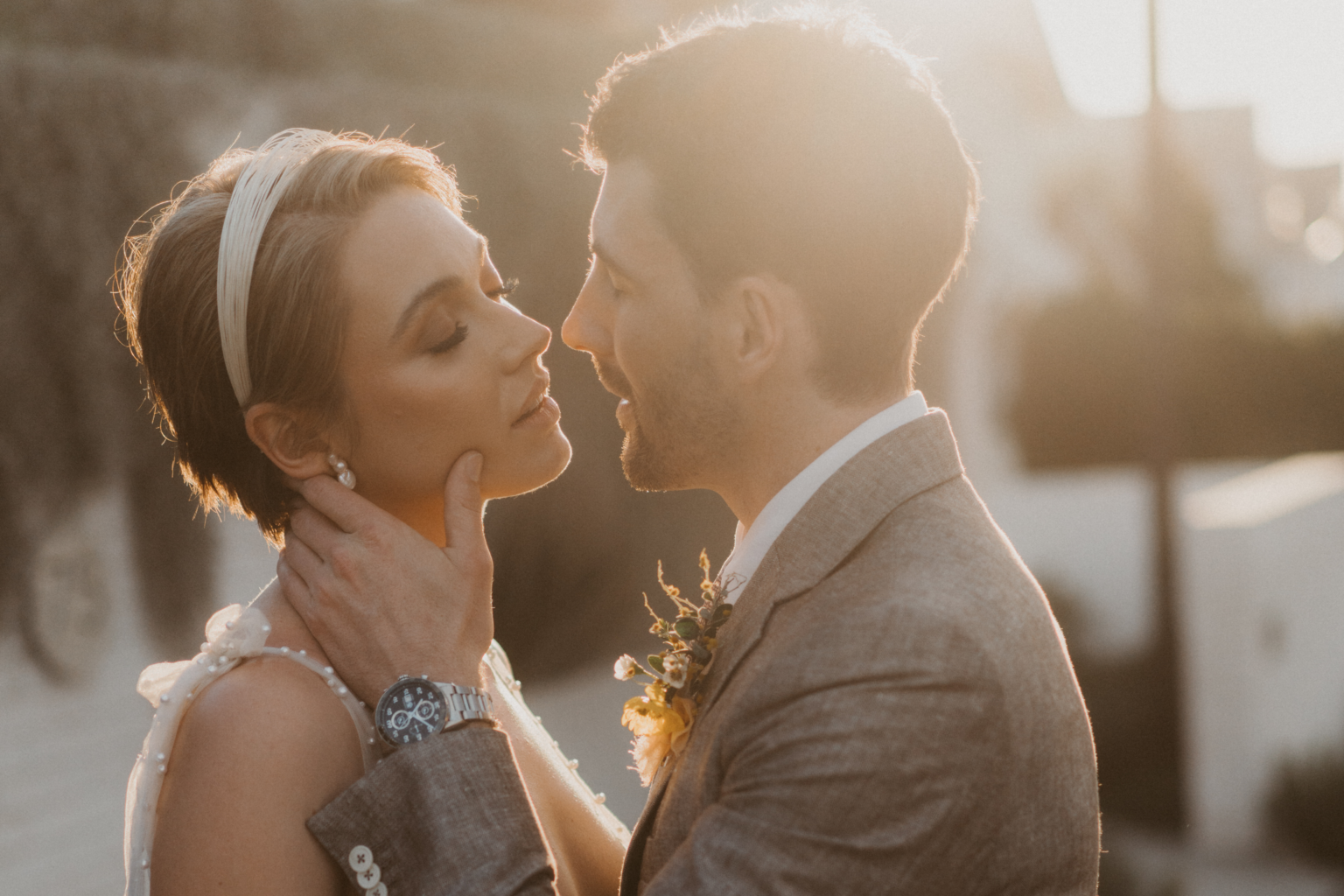 Couple sharing a tender moment in golden light, Potts Point