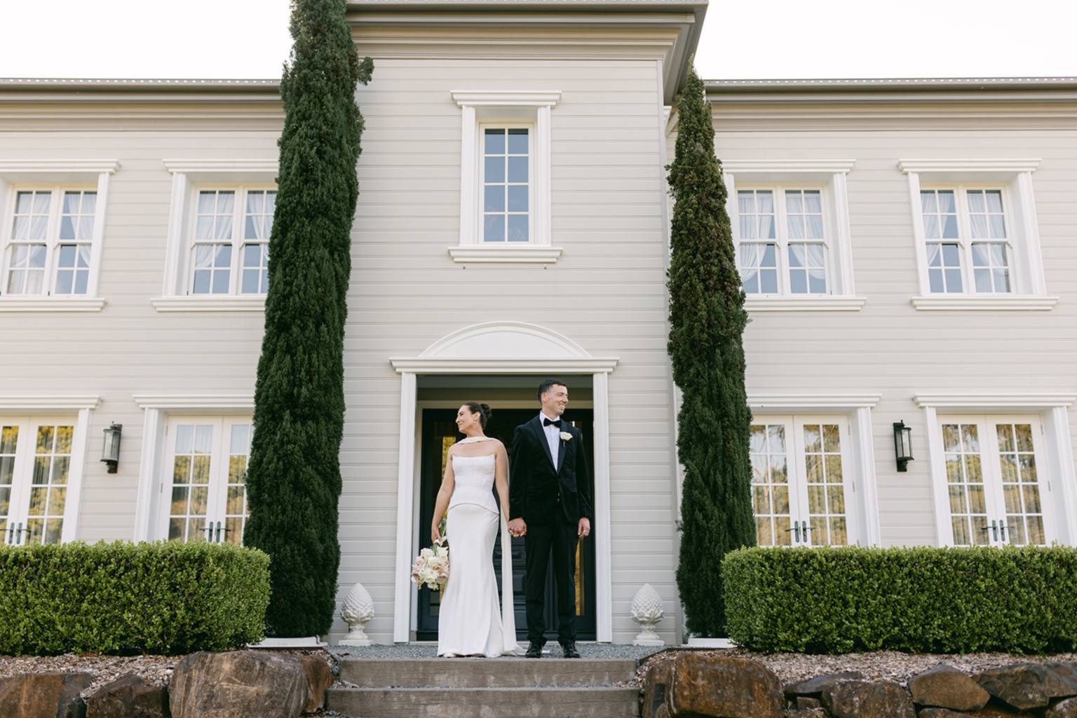 Couple on the front steps of the Wynmère Estate manor