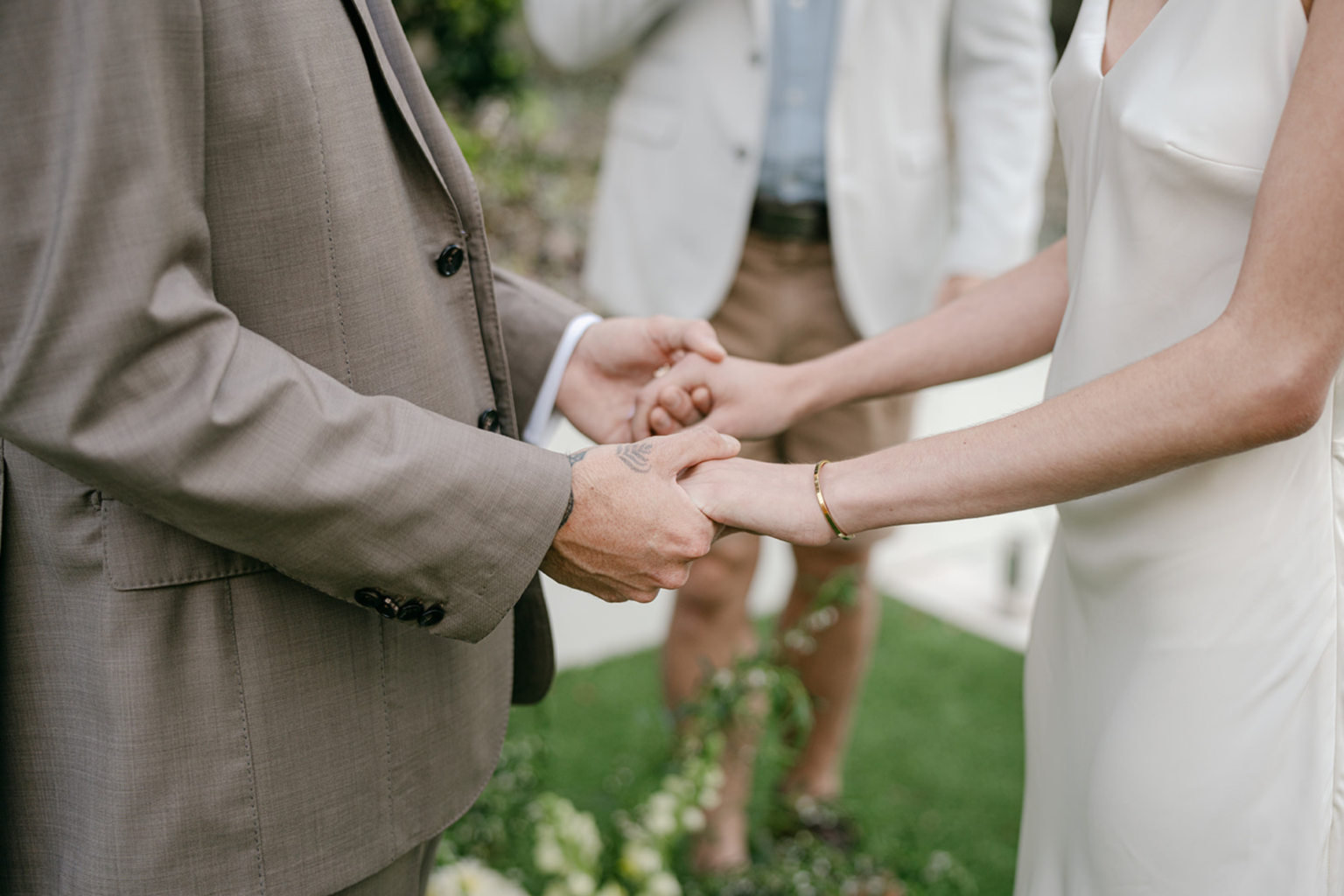 Couple holding hands during their ceremony