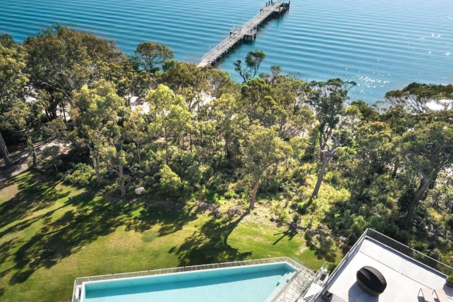 Aerial view of the jetty and bay beside Bannisters Port Stephens