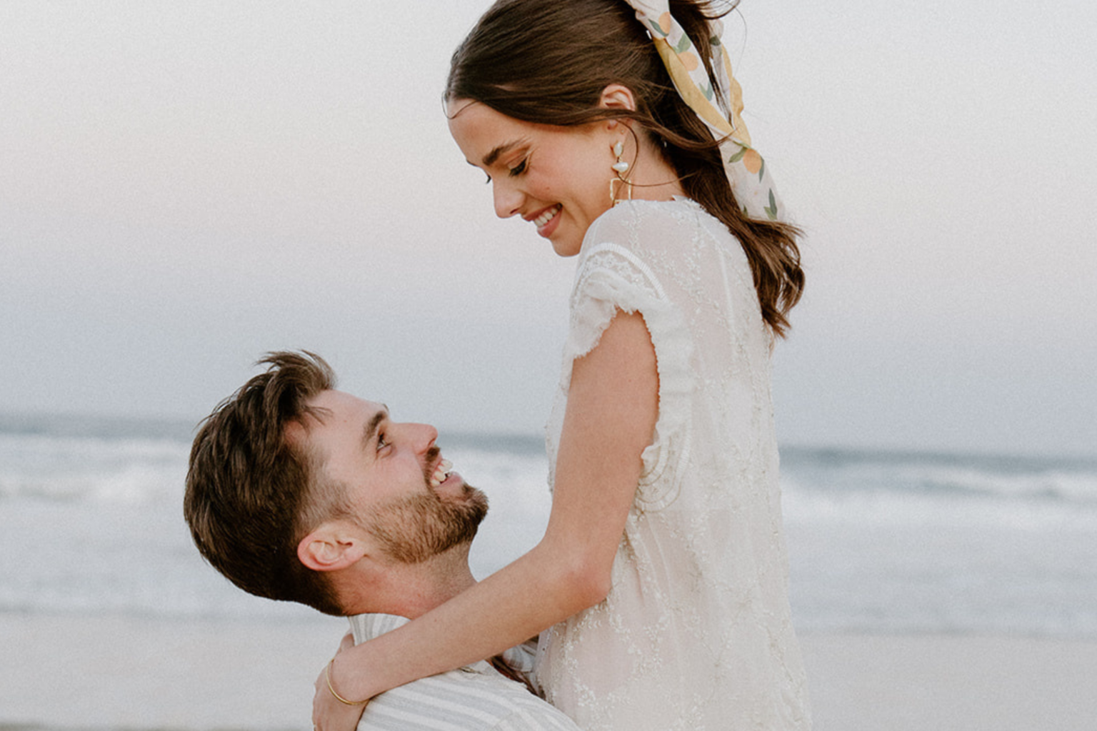 Groom lifting the bride on the beach, Port Stephens