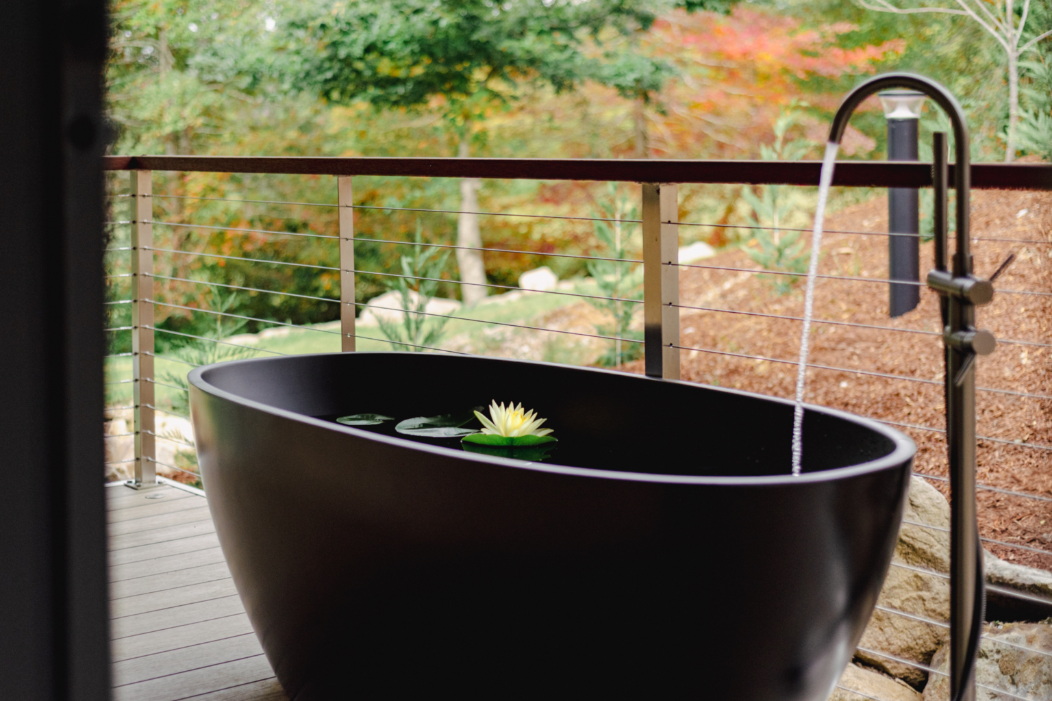 Freestanding bath on a garden deck at Parklands