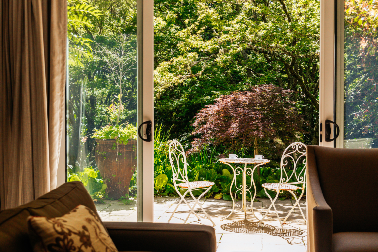 Suite doors opening onto a garden terrace at Parklands