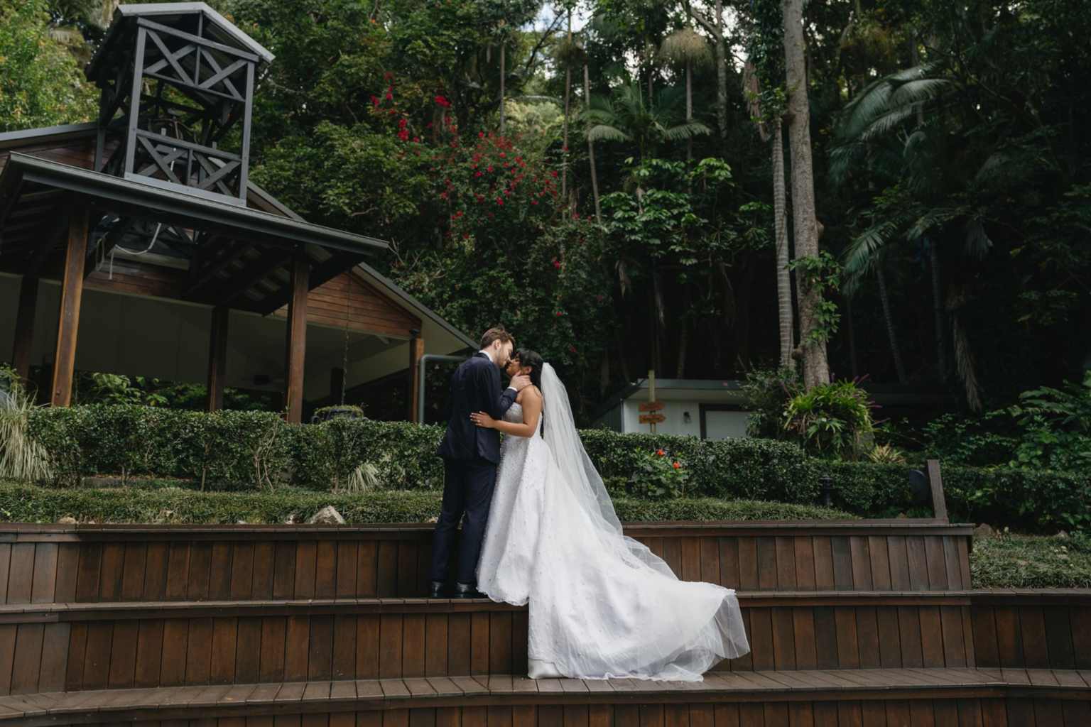 Couple on the garden steps below the chapel at Rainforest Gardens