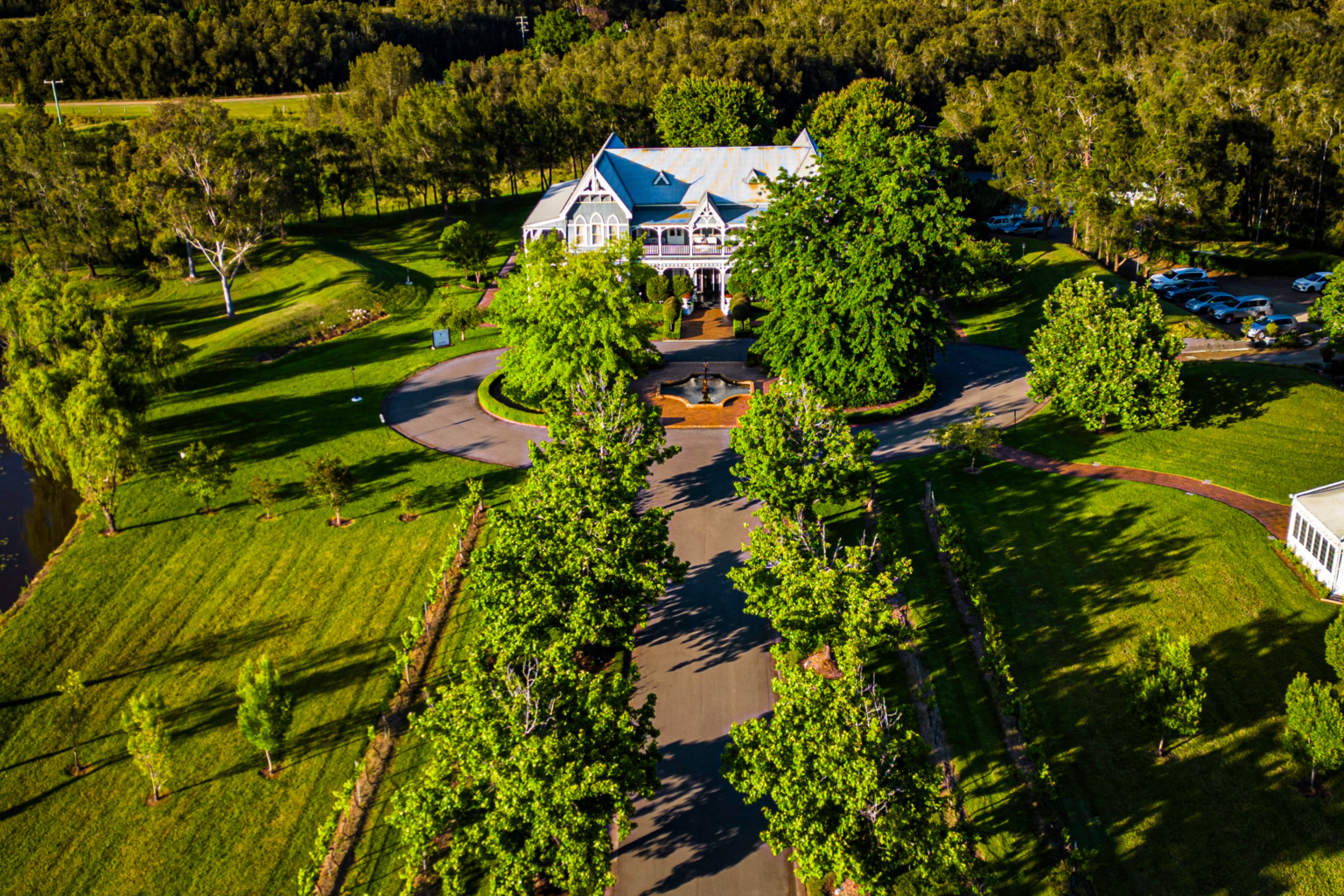 Aerial view of the tree-lined avenue leading to The Convent