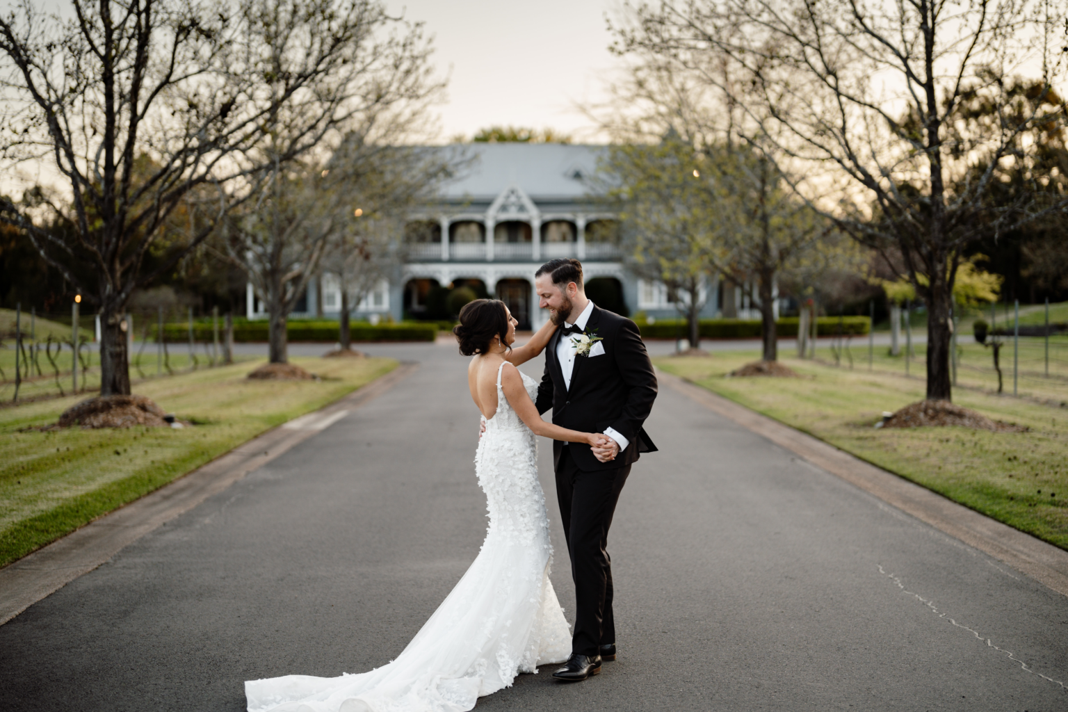 Groom holding the bride on the driveway at The Convent