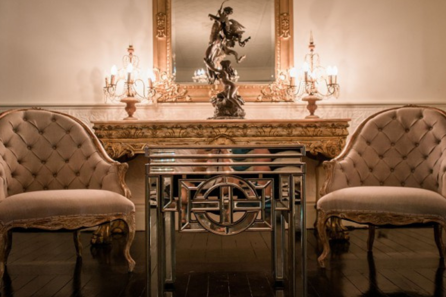 Ornate sitting area with candelabras inside The Convent