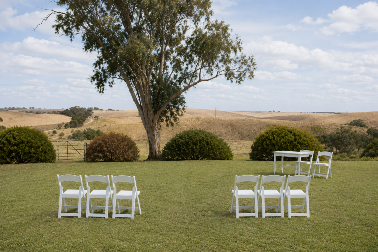 White ceremony chairs on the Homestead Lawn at Kingsford The Barossa