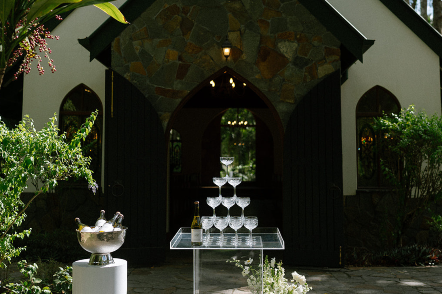Champagne tower set at the stone chapel entrance at Coolibah Downs