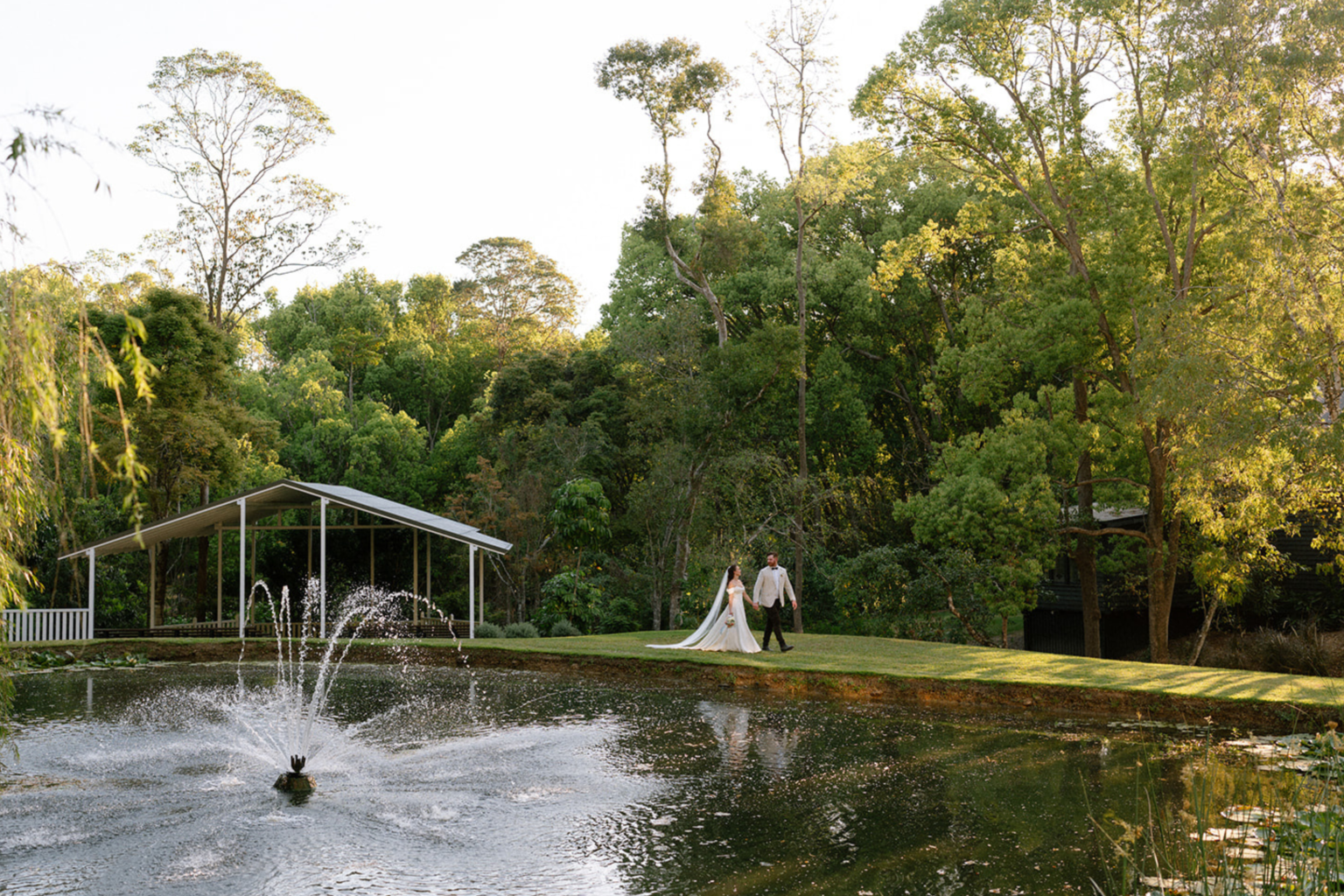 Pond with fountain and garden pavilion at Kwila Lodge