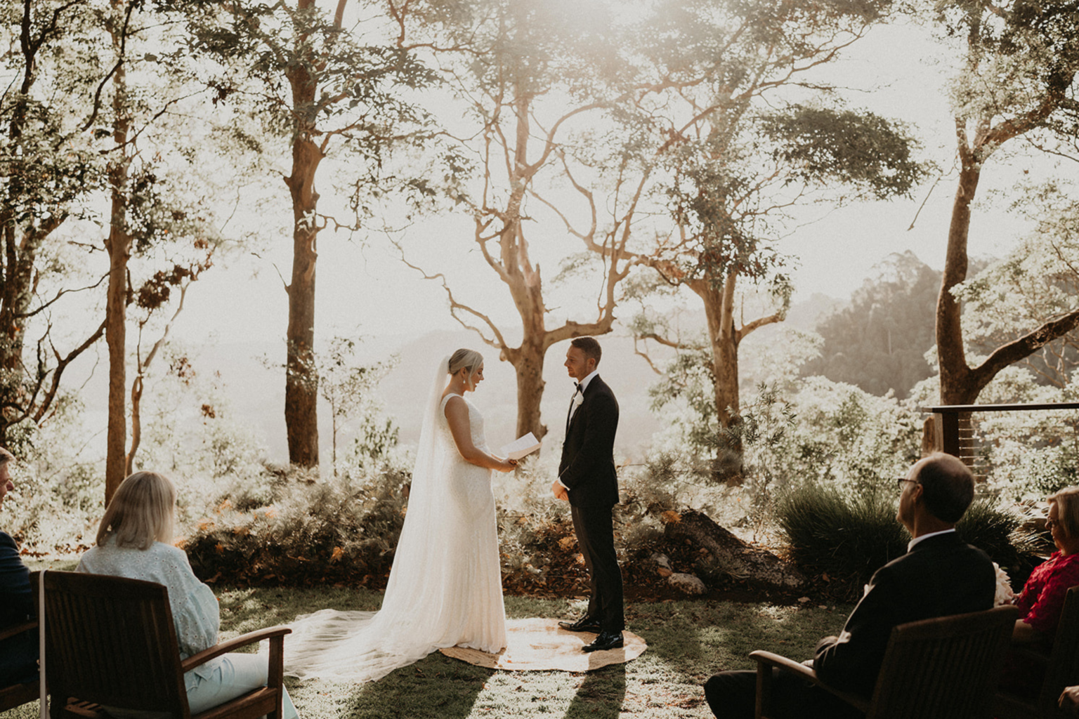 Ceremony under the trees at the Lake View location