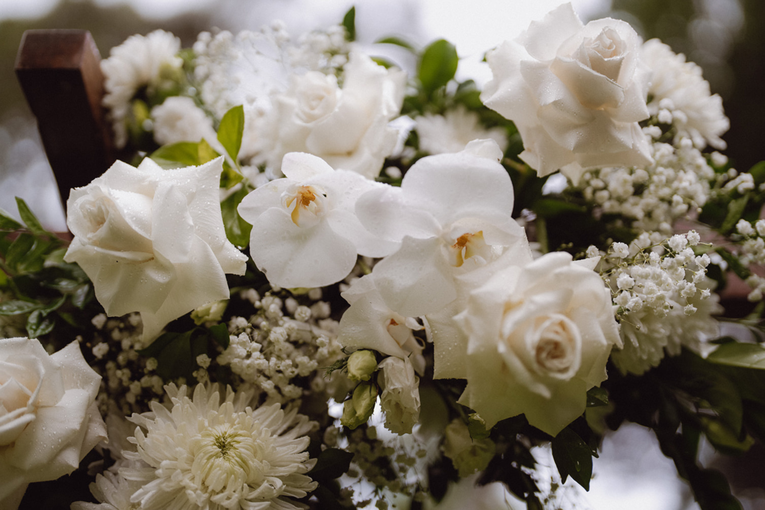 White rose and orchid floral arrangement
