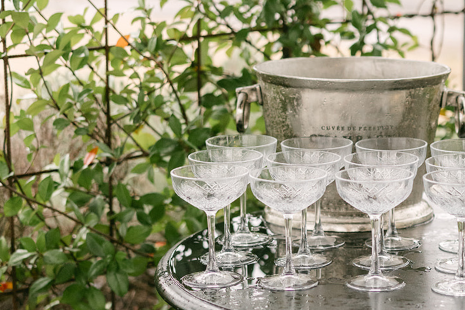 Champagne coupe tower beside an ice bucket